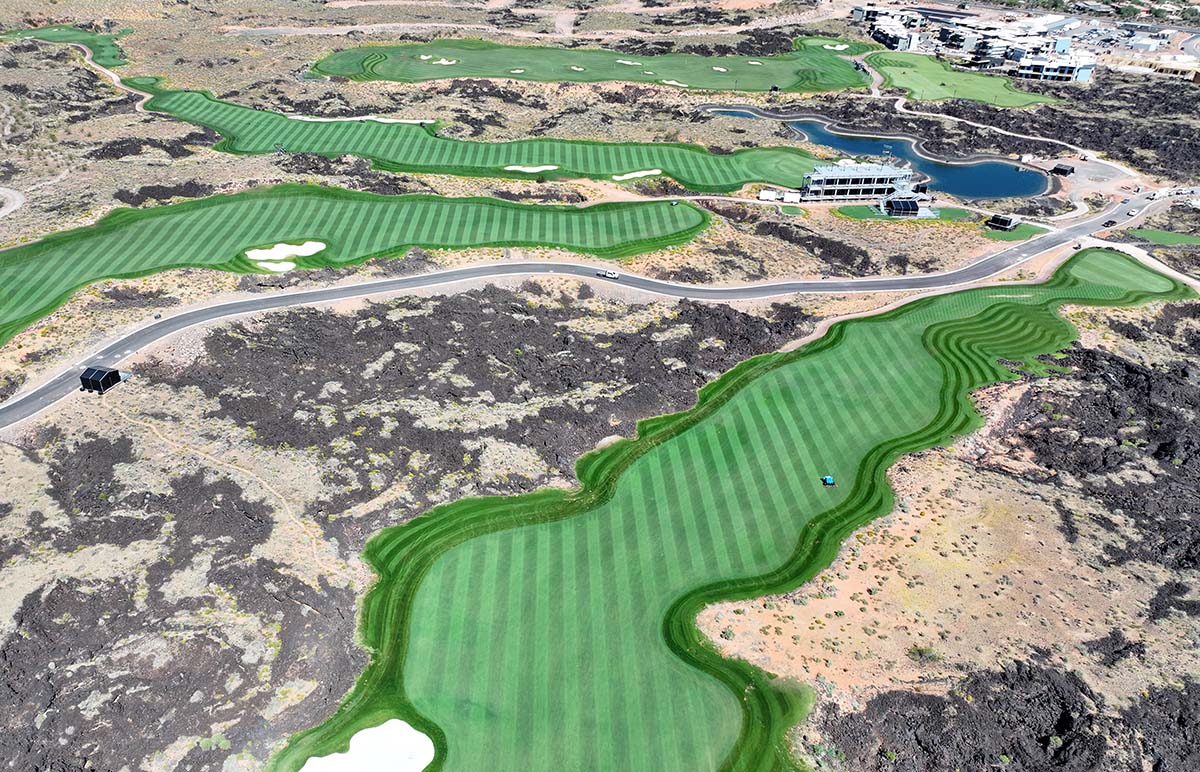 Black Desert golf course with FireFly AMP robotic mowers creating aligned stripes