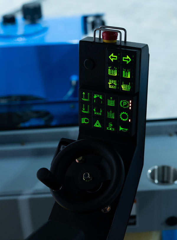 engraved and lit keypad controls inside cab of FireFly turf harvester