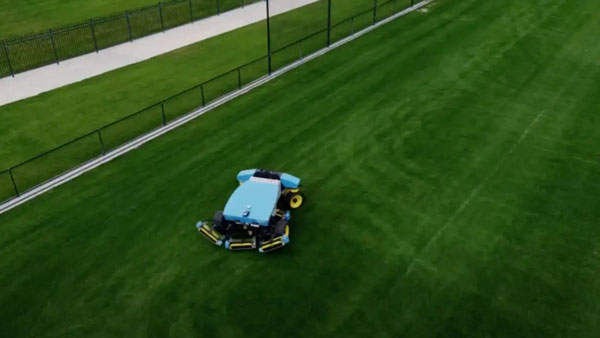 Overhead view of FireFly Automatix robotic mower in a sports field