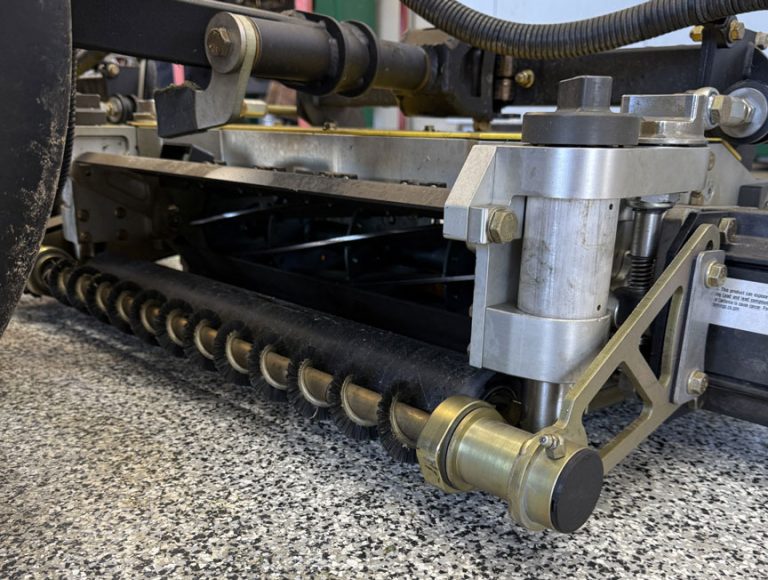 Close up of reel cutting unit with Active Roller Brush installed.