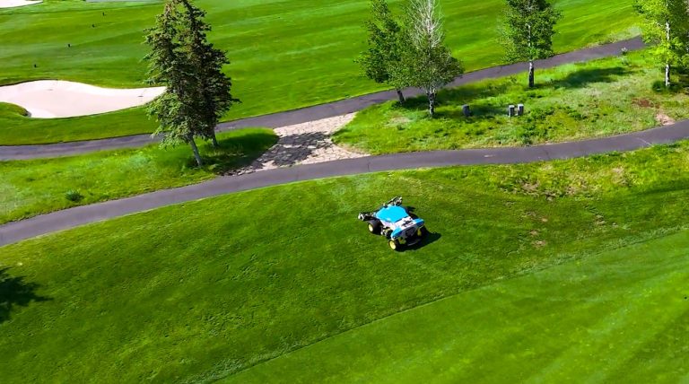 FireFly robotic mower driving autonomously between fairways