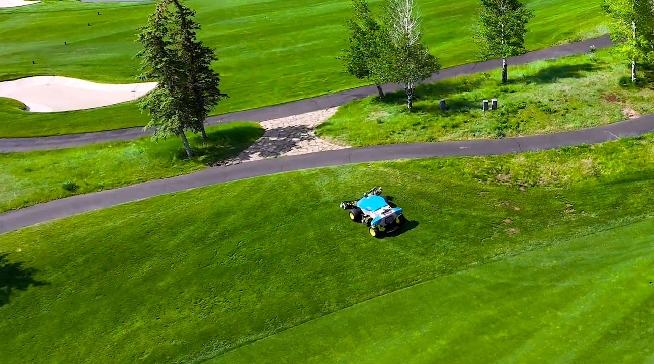 FireFly robotic mower driving autonomously between fairways
