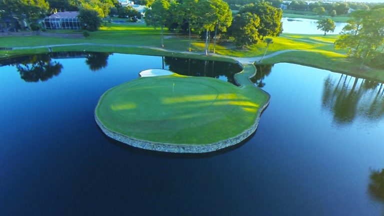an island green in a lake at a golf course